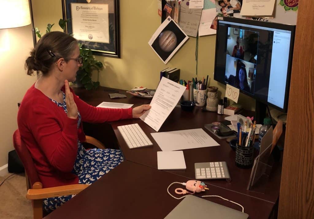 woman takes oath in home office