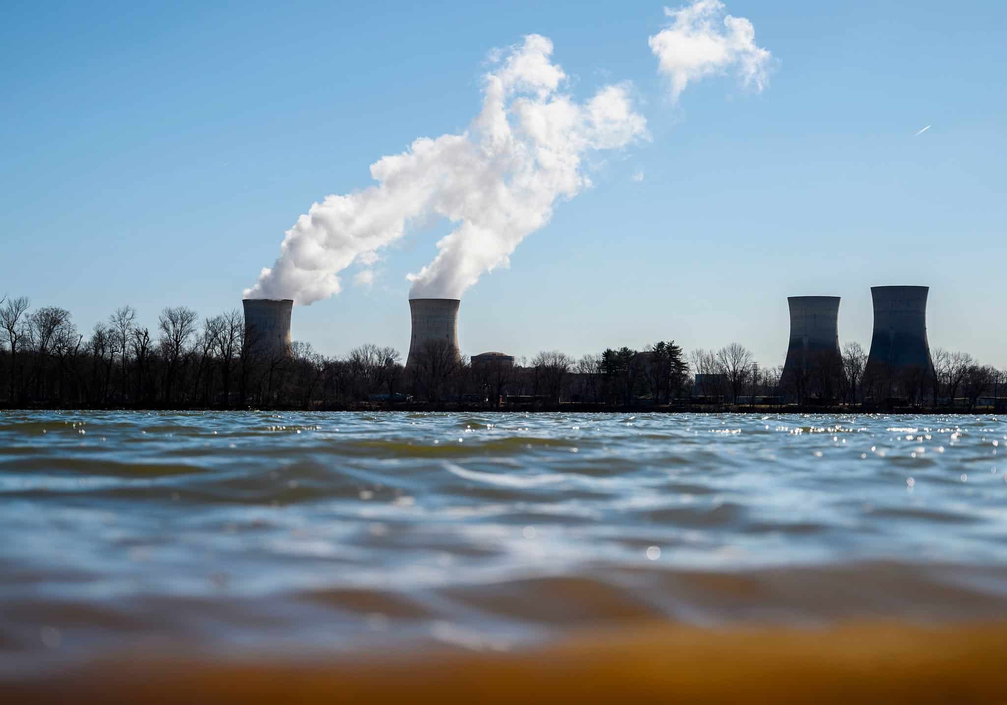 nuclear power plant towers in front of water