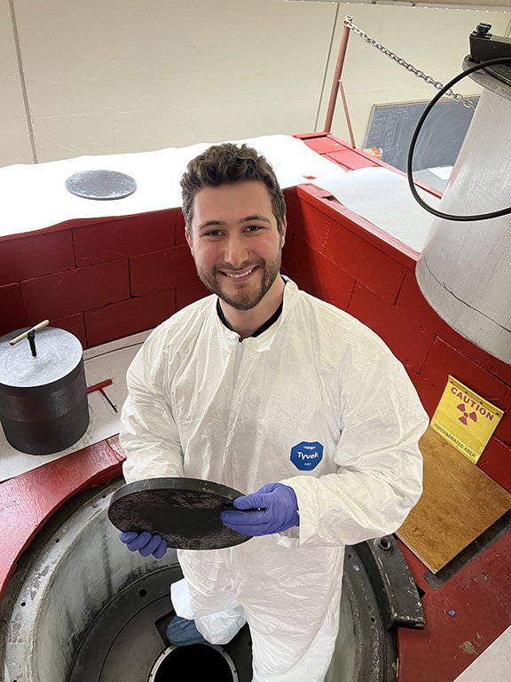 man in white coat working in lab