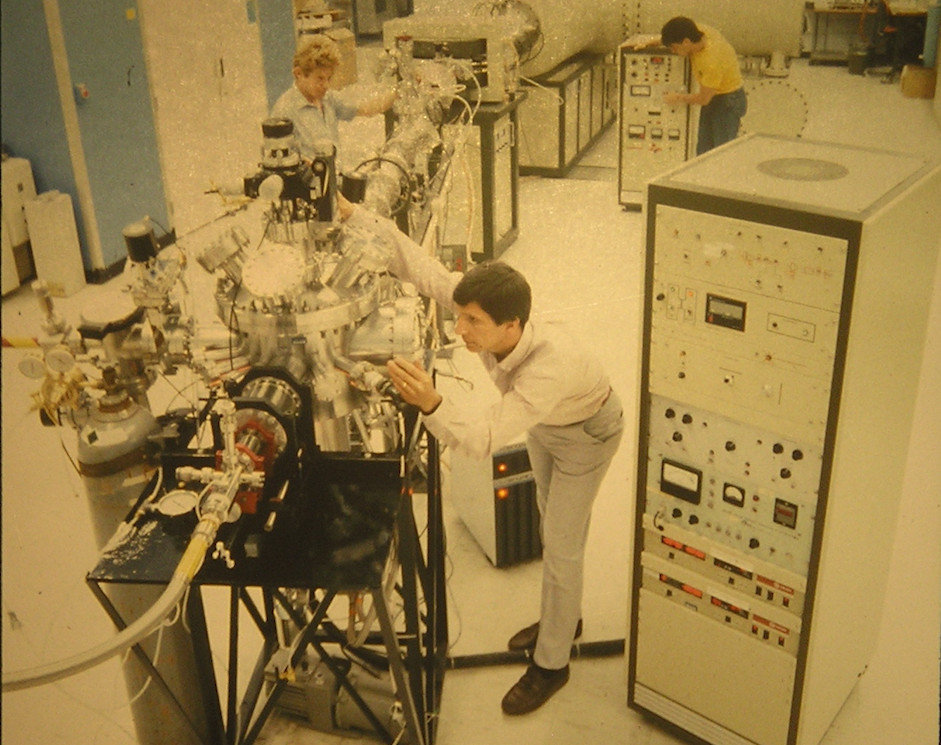 old photo from the 1980s with men working in a lab