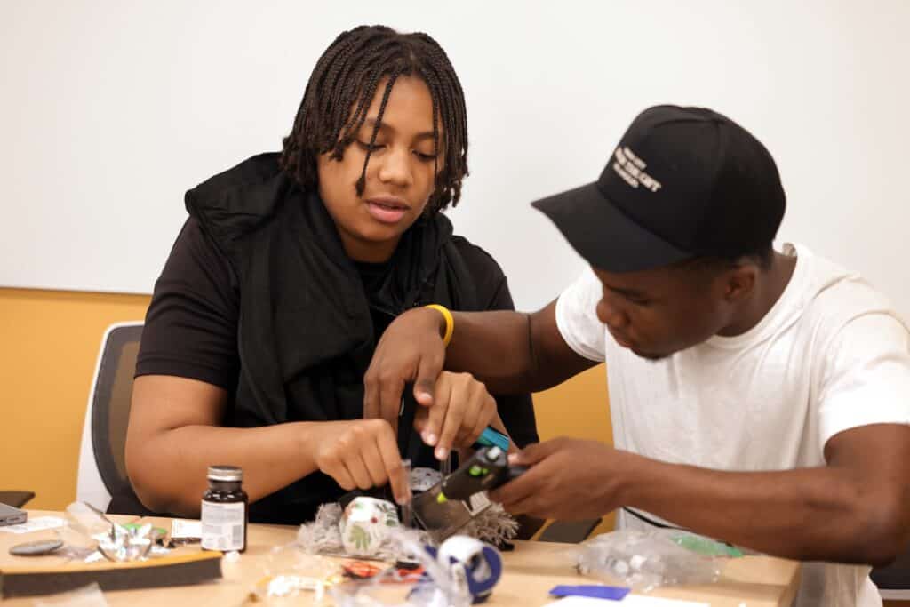 two students working on a diorama project