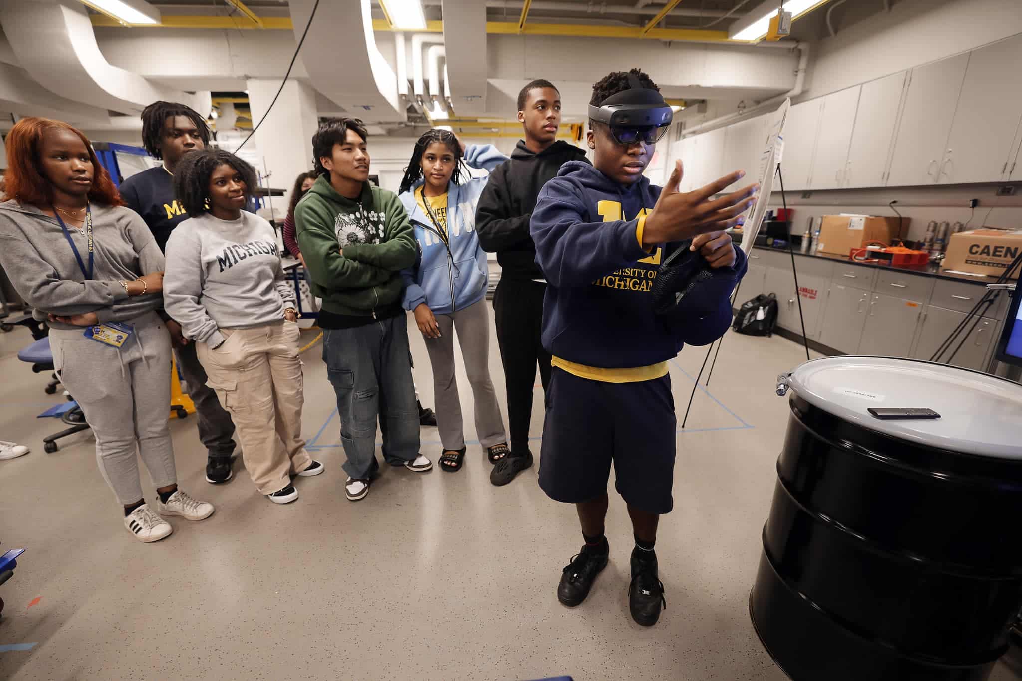 a group of students test out virtual reality headwear and software